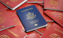 Passport of USA on the pile of passports of other countries. Immigration concept. Passport of USA on the pile of passports of other countries. Immigration concept.